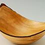 This natural edge bowl is yellow Eucalyptus, about 9" x 7", and the wings are between 3 1/4" to 5 1/4" high. The wall thinckness is about 1/8", tapering to about 5/8" at the bottom.